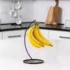 image:imageSpectrum Finley Modern Matte Black Metal Banana Holder Stand for Countertop Stability Sturdy Steel Hanging Fruit Tree Hook for Grapes and Vine Tomatoes Even Ripening and Freshness Kitchen Organizer
